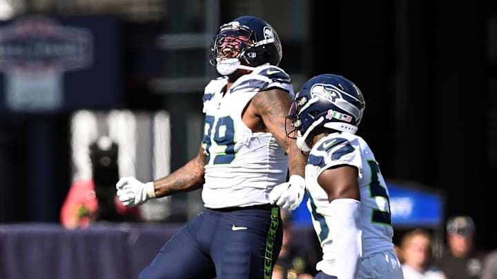 Sep 15, 2024; Foxborough, Massachusetts, USA;  Seattle Seahawks defensive end Leonard Williams (99) reacts after a sack against New England Patriots quarterback Jacoby Brissett (7) during the second half at Gillette Stadium. Mandatory Credit: Brian Fluharty-Imagn Images