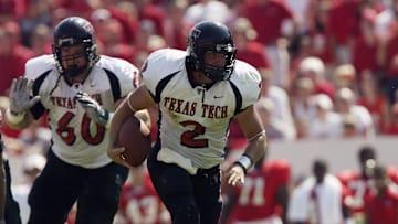 B.J. Symons runs the ball