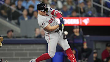 Sep 23, 2024; Toronto, Ontario, CAN; Boston Red Sox designated hitter Tyler O'Neill (17) makes contact with the ball during the seventh inning against the Toronto Blue Jays at Rogers Centre. Mandatory Credit: John E. Sokolowski-Imagn Images