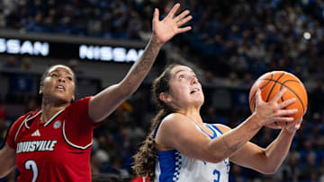 Kentucky Wildcats guard Georgia Amoore (3) makes her way to the basket against Louisville Cardinals forward Nyla Harris (2) during their game on Saturday, Nov. 16, 2024 at Memorial Coliseum in Lexington, Ky.