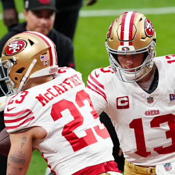 Feb 11, 2024; Paradise, Nevada, USA; San Francisco 49ers quarterback Brock Purdy (13) hands off to San Francisco 49ers running back Christian McCaffrey (23) as they warm up before playing the Kansas City Chiefs in Super Bowl LVIII at Allegiant Stadium. Mandatory Credit: Stephen R. Sylvanie-USA TODAY Sports