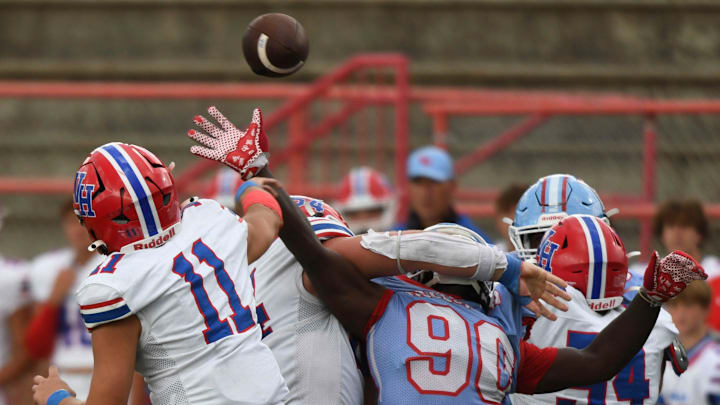Vestavia Hills' Charles Taaffe (11) throws a pass over Hillcrest High defensive lineman Tayvion Johnson (90) at Hillcrest High School Friday Sept. 13, 2024. Vestavia Hills' Charles Taaffe (11) throws a pass over Hillcrest High defensive lineman Tayvion Johnson (90) at Hillcrest High School Friday Sept. 13, 2024.