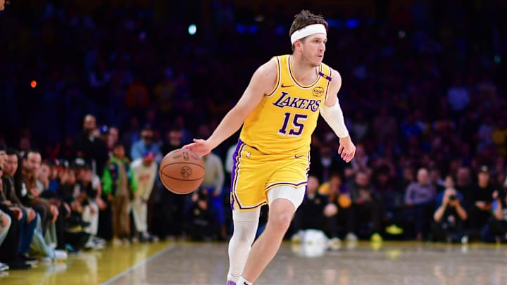 Mar 6, 2025; Los Angeles, California, USA; Los Angeles Lakers guard Austin Reaves (15) moves the ball against the New York Knicks during the second half at Crypto.com Arena. Mandatory Credit: Gary A. Vasquez-Imagn Images