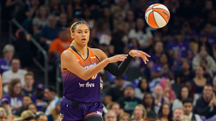 Sep 14, 2025; Phoenix, Arizona, USA; Phoenix Mercury forward Satou Sabally (0) passes the ball in the first half against the New York Liberty during game one of the 2025 WNBA Playoffs round one at PHX Arena. Mandatory Credit: Allan Henry-Imagn Images