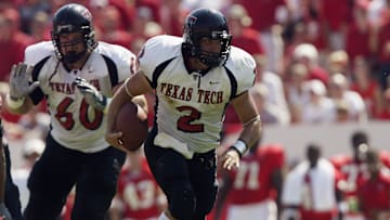 B.J. Symons runs the ball