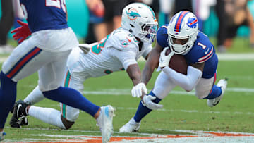 Nov 9, 2025; Miami Gardens, Florida, USA; Miami Dolphins cornerback Jason Marshall Jr. (33) tackles Buffalo Bills wide receiver Curtis Samuel (1).