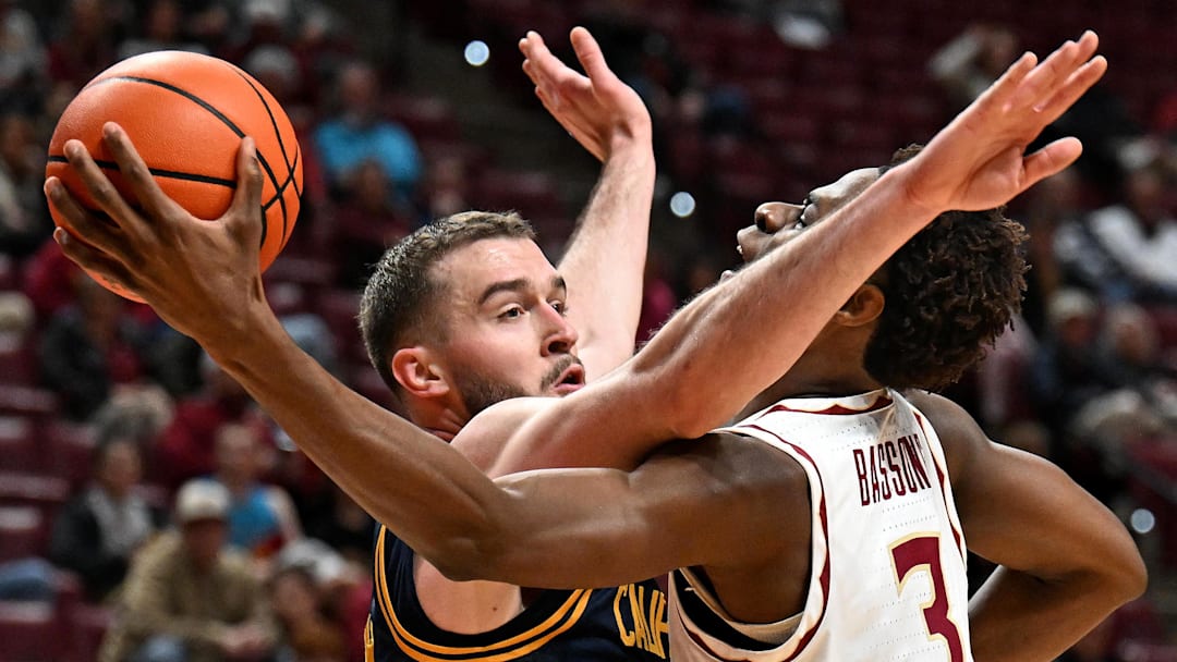 Cal's Milos Ilic, left, engages in physical defense against Florida State