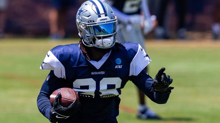 Dallas Cowboys safety Malik Hooker returns an interception during training camp.