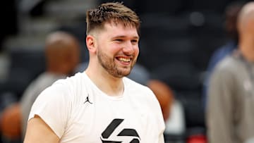 Jun 5, 2024; Boston, MA, USA;  Dallas Mavericks guard Luka Doncic (77) laughs with teammates during the NBA Finals Media Day at TD Garden. Mandatory Credit: Peter Casey-Imagn Images