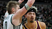 Jan 28, 2025; East Lansing, Michigan, USA;  Minnesota Golden Gophers forward Dawson Garcia (3) tries to get past Michigan State Spartans forward Jaxon Kohler (0) during the first half at Jack Breslin Student Events Center. Mandatory Credit: Dale Young-Imagn Images
