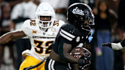 Mississippi State Bulldogs running back Davon Booth (6) runs the ball during the second quarter against the Arizona State Sun Devils at Davis Wade Stadium at Scott Field.