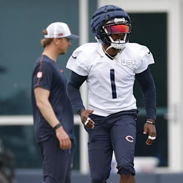Jaylon Johnson appears all in with Ben Johnson (left) and staff after sounding a bit skeptical earlier this year.