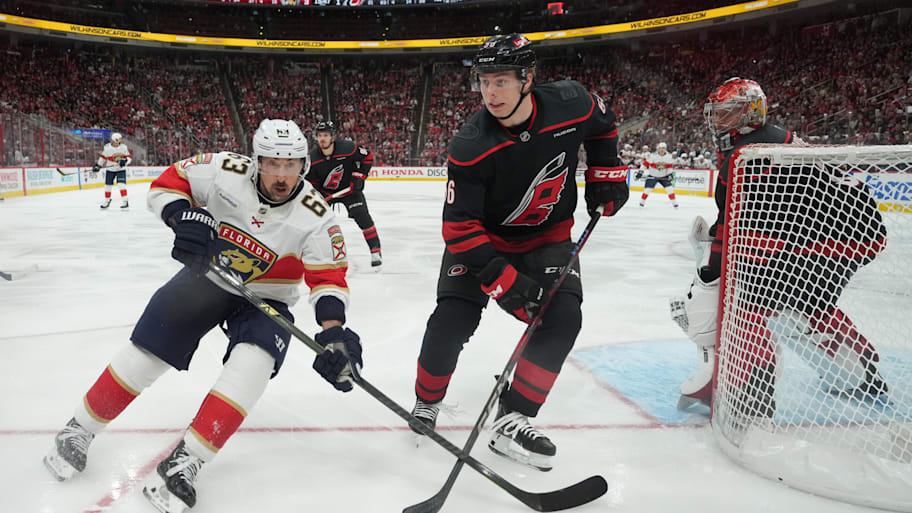 Panthers forward Brad Marchand (63) battles for the puck against Scott Morrow. | James Guillory-Imagn Images