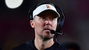 Nov 7, 2025; Los Angeles, California, USA; Southern California Trojans head coach Lincoln Riley watches game action against the Northwestern Wildcats during the second half at the Los Angeles Memorial Coliseum. Mandatory Credit: Gary A. Vasquez-Imagn Images