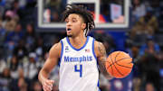 Feb 23, 2025; Memphis, Tennessee, USA; Memphis Tigers guard PJ Haggerty (4) dribbles against the Florida Atlantic Owls during the first half at FedExForum. Mandatory Credit: Wesley Hale-Imagn Images