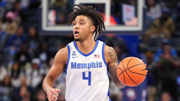 Feb 23, 2025; Memphis, Tennessee, USA; Memphis Tigers guard PJ Haggerty (4) dribbles against the Florida Atlantic Owls during the first half at FedExForum. Mandatory Credit: Wesley Hale-Imagn Images