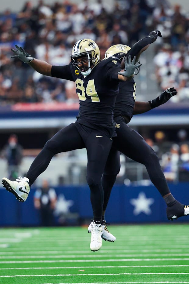 New Orleans Saints defensive end Carl Granderson celebrates with New Orleans Saints defensive end Cameron Jordan
