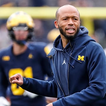 Michigan defensive pass game coordinator an defensive back coach LaMar Morgan talks to players at warmup during the spring game at Michigan Stadium in Ann Arbor on Saturday, April 20, 2024.