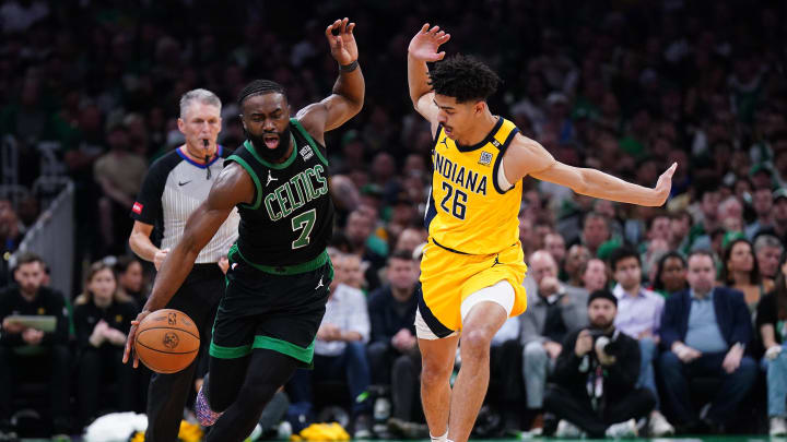 May 23, 2024; Boston, Massachusetts, USA; Boston Celtics guard Jaylen Brown (7) dribbles the ball past Indiana Pacers guard Ben Sheppard (26) in the first half during game two of the eastern conference finals for the 2024 NBA playoffs at TD Garden. Mandatory Credit: David Butler II-USA TODAY Sports