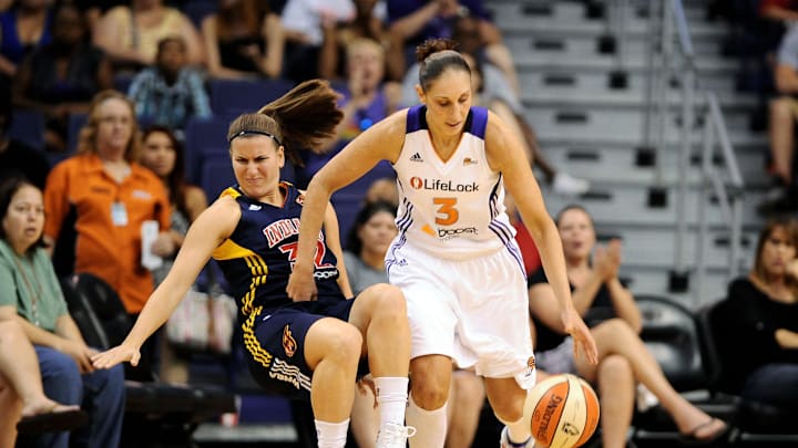 Aug. 25, 2012; Phoenix, AZ, USA; Phoenix Mercury guard Diana Taurasi (3) handles the ball as Indiana Fever guard Jeanette Pohlen (32) falls onto the court during the first half at US Airways Center. Mandatory Credit: Jennifer Stewart-Imagn Images
