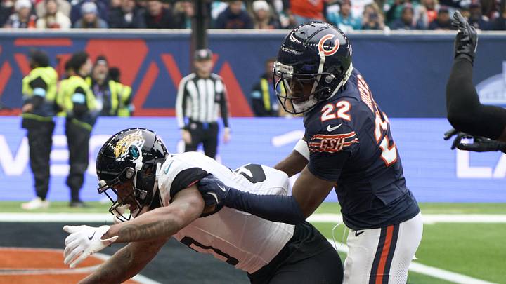 Oct 13, 2024; London, United Kingdom; Chicago Bears safety Elijah Hicks (22) breaks up a pass in the end zone for Jacksonville Jaguars wide receiver Gabe Davis (0)during an NFL International Series game at Tottenham Hotspur Stadium. 