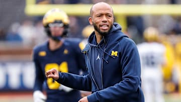 Michigan defensive pass game coordinator and defensive back coach LaMar Morgan talks to players at warmup during the spring game at Michigan Stadium in Ann Arbor on Saturday, April 20, 2024.