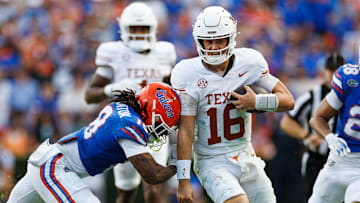 Florida Gators linebacker Aaron Chiles (8) pushes Texas Longhorns quarterback Arch Manning (16)