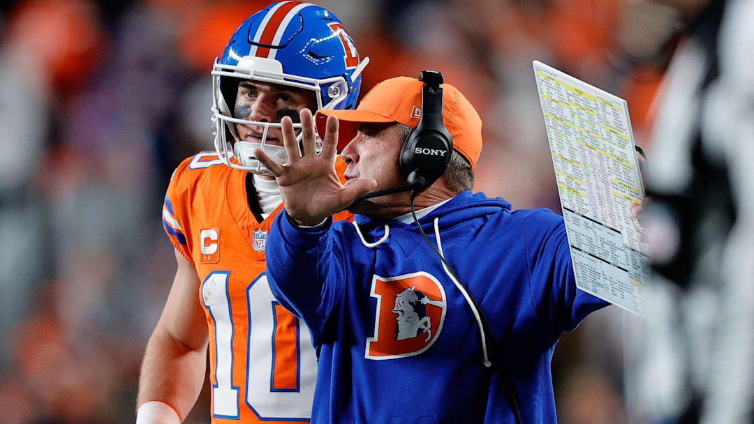 Nov 6, 2025; Denver, Colorado, USA; Denver Broncos quarterback Bo Nix (10) talks with head coach Sean Payton in the fourth quarter against the Las Vegas Raiders at Empower Field at Mile High. 