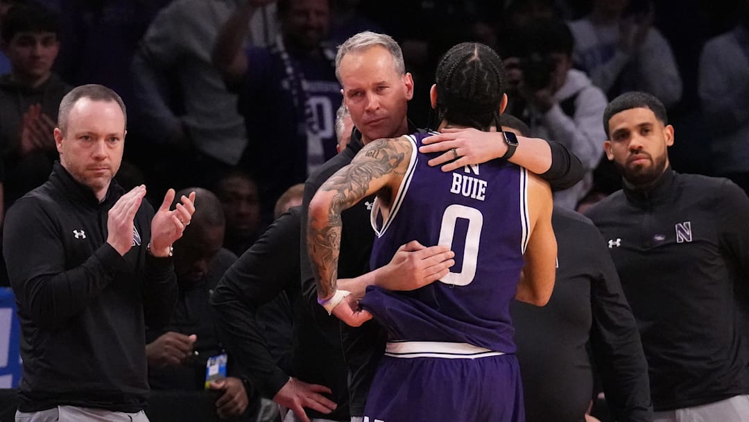 Mar 24, 2024; Brooklyn, NY, USA; Northwestern Wildcats head coach Chris Collins reacts with guard Boo Buie (0) in the second round of the 2024 NCAA Tournament at the Barclays Center. Mandatory Credit: Robert Deutsch-Imagn Images