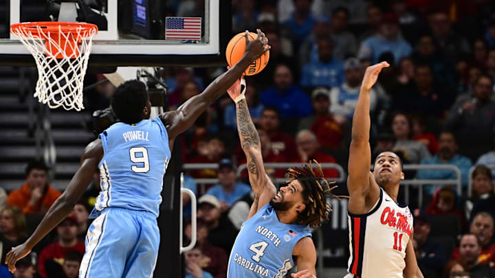 Mar 21, 2025; Milwaukee, WI, USA; North Carolina Tar Heels guard Drake Powell (9) and guard RJ Davis (4) rebound against Mississippi Rebels guard Matthew Murrell (11) during the first half of a first round NCAA men’s tournament game at Fiserv Forum. Mar 21, 2025; Milwaukee, WI, USA; North Carolina Tar Heels guard Drake Powell (9) and guard RJ Davis (4) rebound against Mississippi Rebels guard Matthew Murrell (11) during the first half of a first round NCAA men’s tournament game at Fiserv Forum.