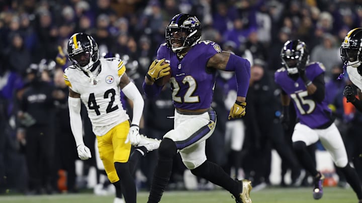 Jan 11, 2025; Baltimore, Maryland, USA; Baltimore Ravens running back Derrick Henry (22) runs for a touchdown against Pittsburgh Steelers cornerback James Pierre (42) in the third quarter in an AFC wild card game at M&T Bank Stadium. Mandatory Credit: Geoff Burke-Imagn Images Jan 11, 2025; Baltimore, Maryland, USA; Baltimore Ravens running back Derrick Henry (22) runs for a touchdown against Pittsburgh Steelers cornerback James Pierre (42) in the third quarter in an AFC wild card game at M&T Bank Stadium. Mandatory Credit: Geoff Burke-Imagn Images