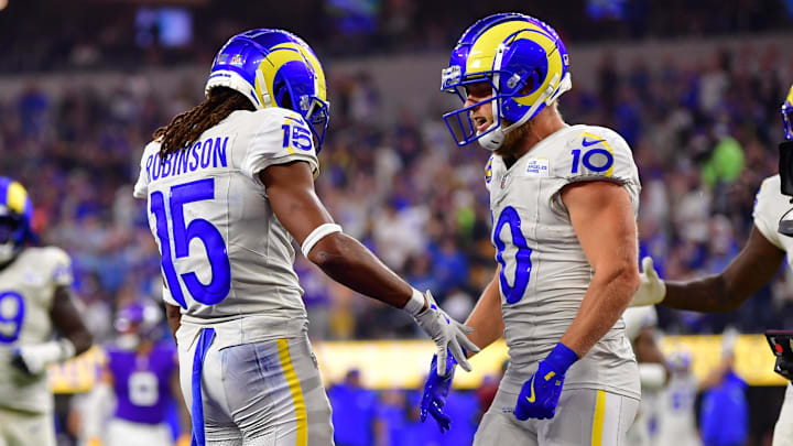 Kupp (right) has been the subject of trade speculation all week, but delivered a major contribution to the Rams in Thursday's win over the Vikings.