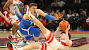 Dec 14, 2024; Phoenix, Arizona, USA; Arizona Wildcats guard Anthony Dell'Orso (3) grabs a loose ball against UCLA Bruins forward Tyler Bilodeau (34) in the second half at Footprint Center. Mandatory Credit: Mark J. Rebilas-Imagn Images