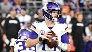 Minnesota Vikings quarterback Sam Darnold looks to pass against the Los Angeles Rams in the Wild Card Round