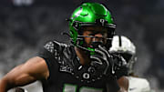 Dec 7, 2024; Indianapolis, IN, USA; Oregon Ducks tight end Kenyon Sadiq (18) runs for a touchdown during the first quarter against the Penn State Nittany Lions in the 2024 Big Ten Championship game at Lucas Oil Stadium. Mandatory Credit: Robert Goddin-Imagn Images