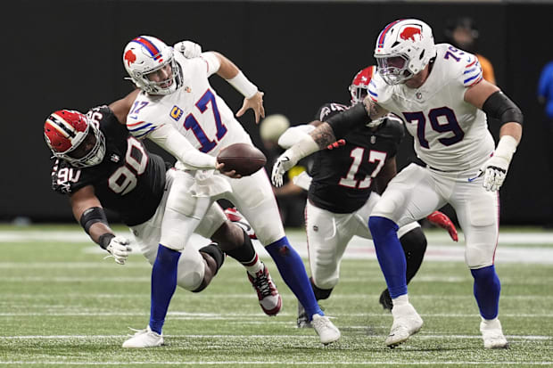 Josh Allen is hit by a defender