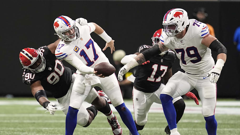 Josh Allen is hit by a defender