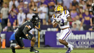 Oct 21, 2023; Baton Rouge, Louisiana, USA; LSU Tigers running back Logan Diggs (3) carries the ball against the Army Black Knights during the first half at Tiger Stadium. Mandatory Credit: Danny Wild-USA TODAY Sports
