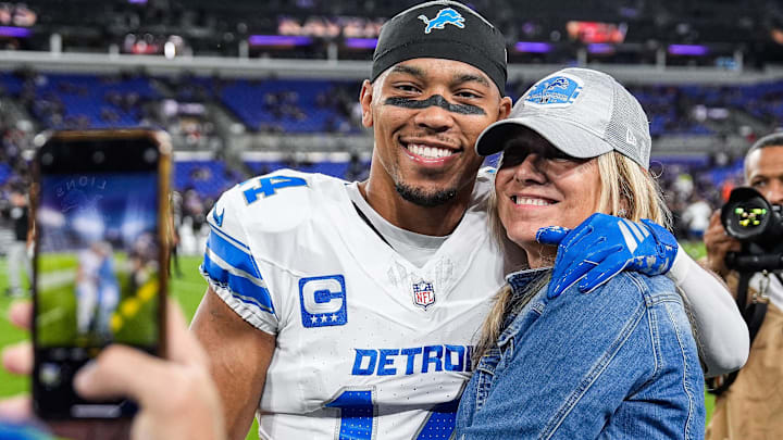 Detroit Lions wide receiver Amon-Ra St. Brown (14) poses for a photo with his mother Miriam Brown during warm up ahead of game against Baltimore Ravens at M&T Bank Stadium in Baltimore, Md. on Monday, Sept. 22, 2025.
