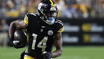Oct 6, 2024; Pittsburgh, Pennsylvania, USA;  Pittsburgh Steelers wide receiver George Pickens (14) runs after a catch against the Dallas Cowboys during the fourth quarter at Acrisure Stadium. Dallas won 20-17. Mandatory Credit: Charles LeClaire-Imagn Images