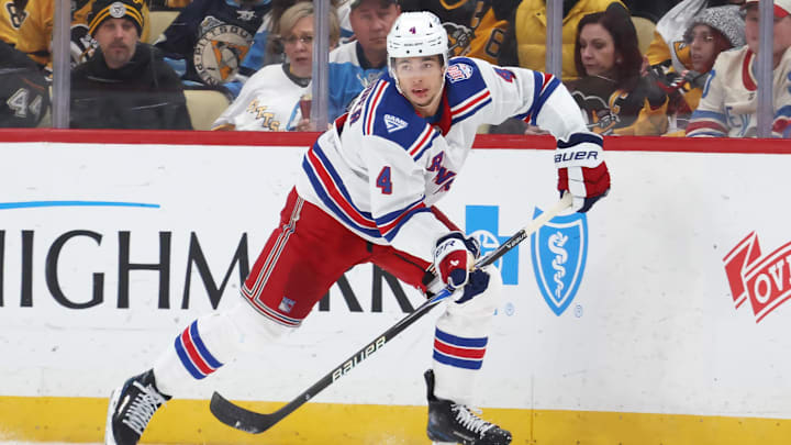 Jan 31, 2026; Pittsburgh, Pennsylvania, USA;  New York Rangers defenseman Braden Schneider (4) moves the puck against the Pittsburgh Penguins during the second period at PPG Paints Arena. Mandatory Credit: Charles LeClaire-Imagn Images