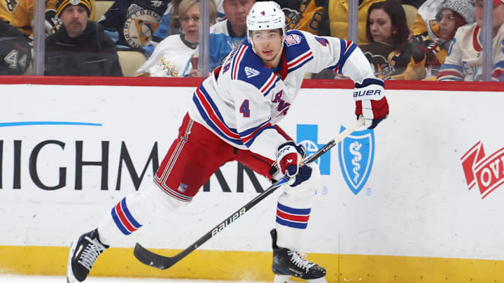 Jan 31, 2026; Pittsburgh, Pennsylvania, USA;  New York Rangers defenseman Braden Schneider (4) moves the puck against the Pittsburgh Penguins during the second period at PPG Paints Arena. Mandatory Credit: Charles LeClaire-Imagn Images