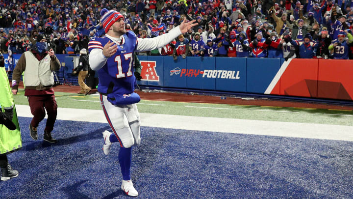 Bills quarterback Josh Allen celebrates with fans after beating the Patriots 47-17.