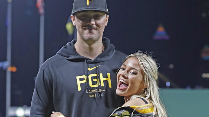 Pittsburgh Pirates starting pitcher Paul Skenes (30) poses with his girlfriend Louisiana State University gymnast Livvy Dunn (right) after making his major league debut. Pittsburgh Pirates starting pitcher Paul Skenes (30) poses with his girlfriend Louisiana State University gymnast Livvy Dunn (right) after making his major league debut.