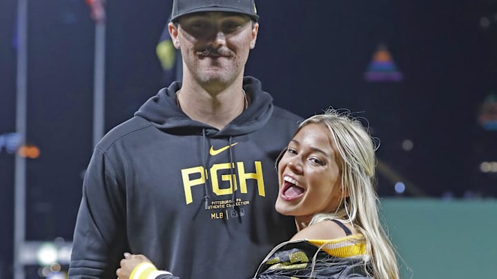 Pittsburgh Pirates starting pitcher Paul Skenes (30) poses with his girlfriend Louisiana State University gymnast Olivia Dunn.