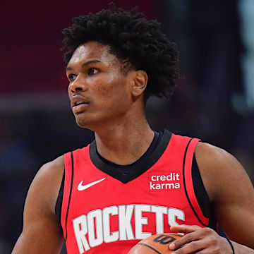 Apr 14, 2024; Los Angeles, California, USA; Houston Rockets forward Amen Thompson (1) controls the ball against the Los Angeles Clippers during the first half at Crypto.com Arena. Mandatory Credit: Gary A. Vasquez-Imagn Images