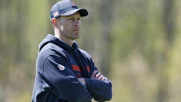Chicago Bears head coach Ben Johnson (R) looks on during the Rookie Minicamp at Halas Hall.