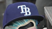 Sep 26, 2025; Toronto, Ontario, CAN; The hat and glove of Tampa Bay Rays third baseman Junior Caminero (13) in the dugout during the game against the Toronto Blue Jays at Rogers Centre. 