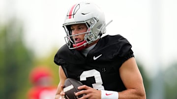 Ohio State Buckeyes quarterback Lincoln Kienholz (3) takes a snap during the first football practice of the season at the Woody Hayes Athletic Center on July 31, 2025.