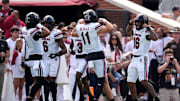 South Carolina Gamecocks quarterback LaNorris Sellers (16) celebrates with quarterback Davis Beville (11) after a touchdown during a college football game between the University of Oklahoma Sooners (OU) and the South Carolina Gamecocks at Gaylord Family - Oklahoma Memorial Stadium in Norman, Okla., Saturday, Oct. 19, 2024.